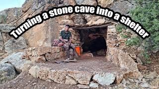 Transforming an old stone cave into a wonderful sanctuary with a fireplace