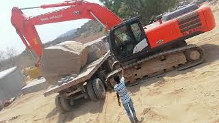 Tata hitachi 370 track loding granite Blocks