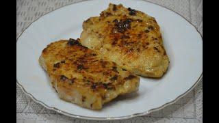 Pork steak in a pan.