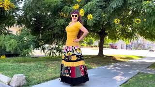 Ameynra design patchwork skirt. Yellow-black multicolor with pink & red flowers. Sofia Goldberg