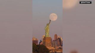 VIDEO: Supermoon rises behind Statue of Liberty