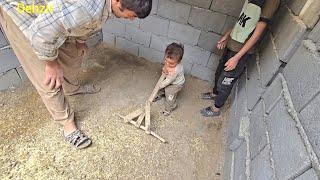 Family effort: the story of the roof and floor of the donkey stand by Aghaqarboun and his children.