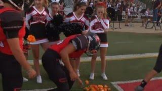 Football Team Gives Roses to Ill Cheerleader