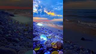 Mesmerizing Coastal Views: Shimmering Stones, Sand, and Water Harmony   #CoastalBeauty #NatureLovers