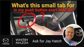 What is the 'small tab' by your Mazda shifter?