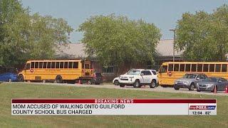 Mom accused of walking onto Guilford County school bus charged