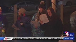 Carolers at cemetery dedicate songs to those mourning loved ones