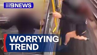 Social media trend of riding Sydney trains while hanging out of doors | 9 News Australia