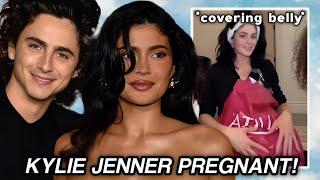 Kylie Jenner PREGNANT with Timothee Chalamet's baby? COVERS her belly! *THE TRUTH* | Cine Chic