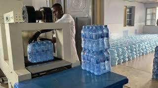 Bottled water production machine producing portable bottled water at the manufacturing factory