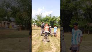 Tractor behind the statue