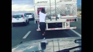 Man removes Confederate battle flag off a truck in the middle of traffic