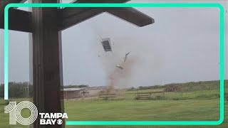 Landspout sends sheets of metal flying in Polk County yard