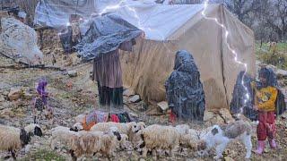 Breathtaking efforts of a nomadic woman for her children under the rain in the mountains.wintercold