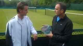 Alex Slabinsky receives his AEGON Award from Paul Annacone