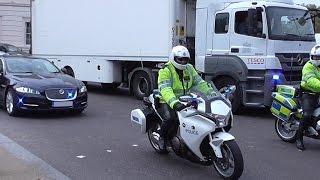 Metropolitan Police Special Escort Group & Traffic Unit escorting a car