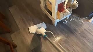 Black and Decker steam mop on luxury vinyl flooring.