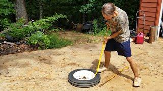 Tractor Mechanic Changes Tires