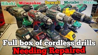 A full box of mixed cordless drills in for repair. Makita, Dewalt, Metabo, Milwaukee and Hikoki.