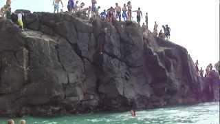 Kelsey's first jump off the Rock at North Shore Beach HI with Casey and Mitchell