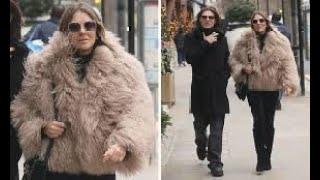 Elizabeth Hurley, cuts a stylish figure in a beige faux-fur coat as she joins lookalike son Damian