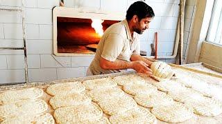 Baking bread in a bakery / the most popular bread in Iran / Iranian Berber bread