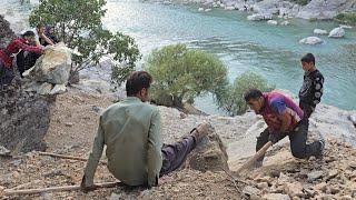 Traditional life in the cave: preparing stone from the mountain to build a house for Iranian nomads