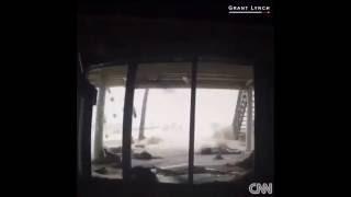 Waves crash into a home in Palm Coast, Florida, as Hurricane Matthew moves along the Florida coast