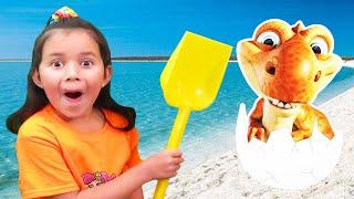 Dinosaur Egg On The Beach Zoe & Daddy Find Giant Surprise Eggs in the Sand!