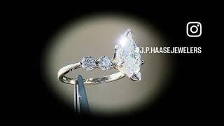 1.66CT marquise set in yellow gold single prong 4-stone setting.