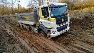 Truck got stuck in mud! Dump trucks and timber trucks transport cargo in extreme off-road conditions