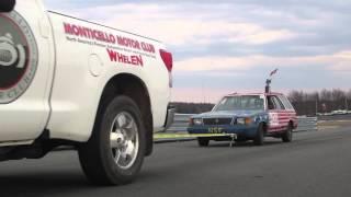 24 Hours of LeMons Plymouth Reliant K wagon dragged off track with wheels locked