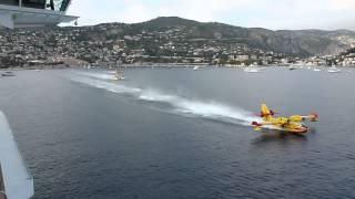 Water Bombers load up next to cruise liner