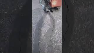 Filling in the cracks #fyp #satisfying #crackfill #oddlysatisfying #asphalt #parkinglot