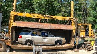 Car crushing time at the junkyard