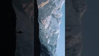 beautiful filmed aerial footage of a solo trekker hiking in the ridge of north Annapurna base camp