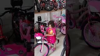 little girl choosing a princess pink cycle in a cycle shop #shorts