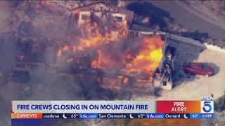 Fire crews closing in on Mountain Fire