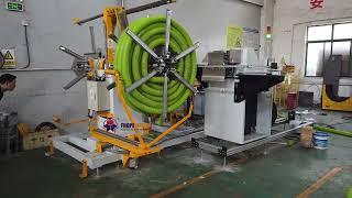 Double wall hose coiling and strapping machine