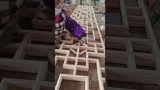 Carpenter demonstrates craftsmanship in making wooden window doors