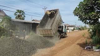 Perfect Action Of Dump Truck Unloading Gravel To Spread For New Road Build