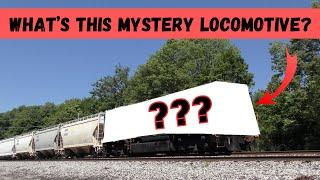 A Mystery Locomotive used as a DPU pushing up the end of a very long train!