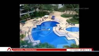 Taxi 'dives' into condo swimming pool - 10Nov2013