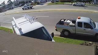 Security Video: Vehicle Crashes into Law Offices of John M Phillips