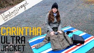 Unboxing & Review: Carinthia G-LOFT Ultra Jacket in oliv. Jackie packt aus und schlüpft rein.