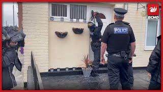 Merseyside police carry out raids linked to recent gun violence in the city