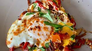 Eggs with veggies and chorizo.