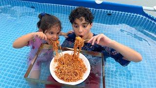 Children eat in the pool