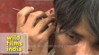 Cleaning ears with pins - It happens only in India