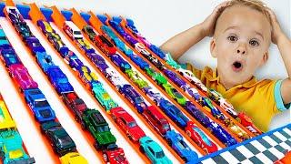 Chris plays with Hot Wheels cars and builds Hot Wheels City